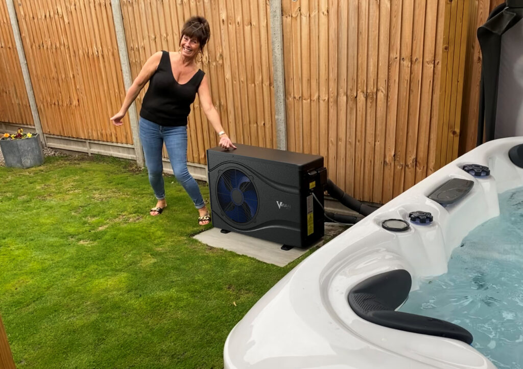 Customer looking happy with the installation of her Vian heat pump S7/9