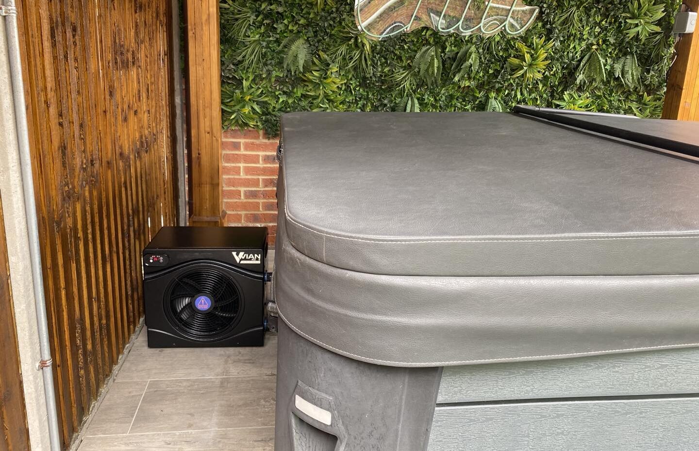 Vian heat pump sat next to a hot tub
