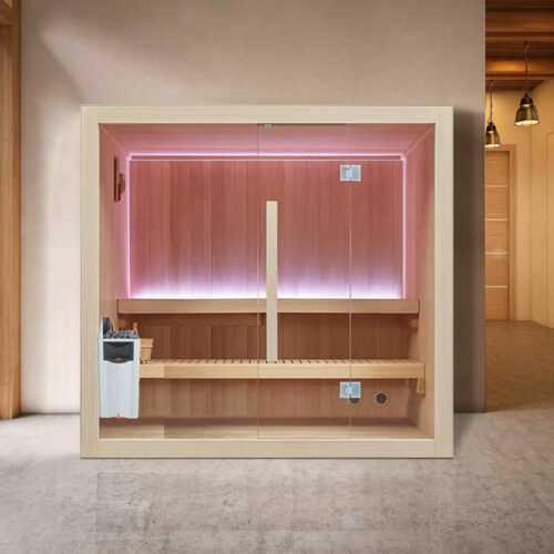 Modern indoor sauna with wooden paneling and soft pink lighting next to large windows showing a snowy landscape. The space feels warm and inviting.
