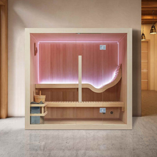 Modern indoor sauna with wooden paneling and soft pink lighting next to large windows showing a snowy landscape. The space feels warm and inviting.