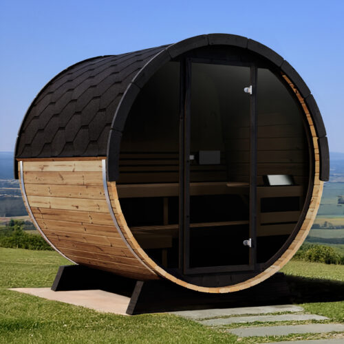 A wooden barrel sauna with a black shingled roof sits on grassy terrain under a clear blue sky. The circular entrance is visible, emitting a serene vibe.